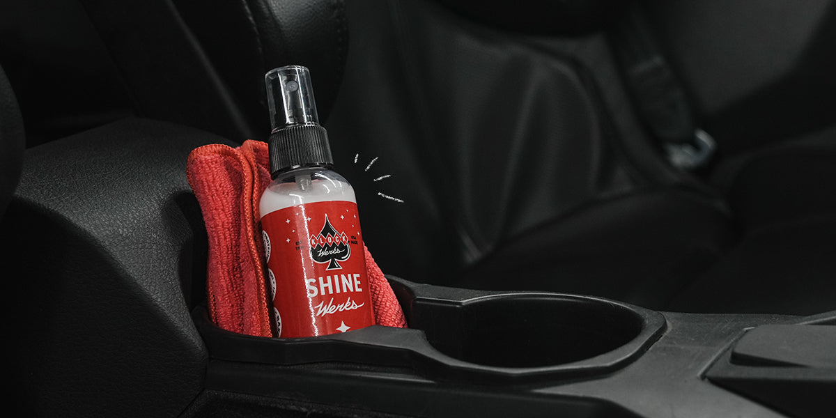 Klock Werks Shine Werks 4oz car detailing spray stored in vehicle cup holder.