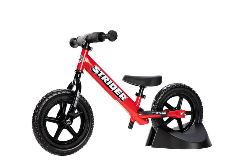 Strider Plastic Bike Stand holding a Strider Bike (Plastic Bike Stand holding a Strider Bike)
