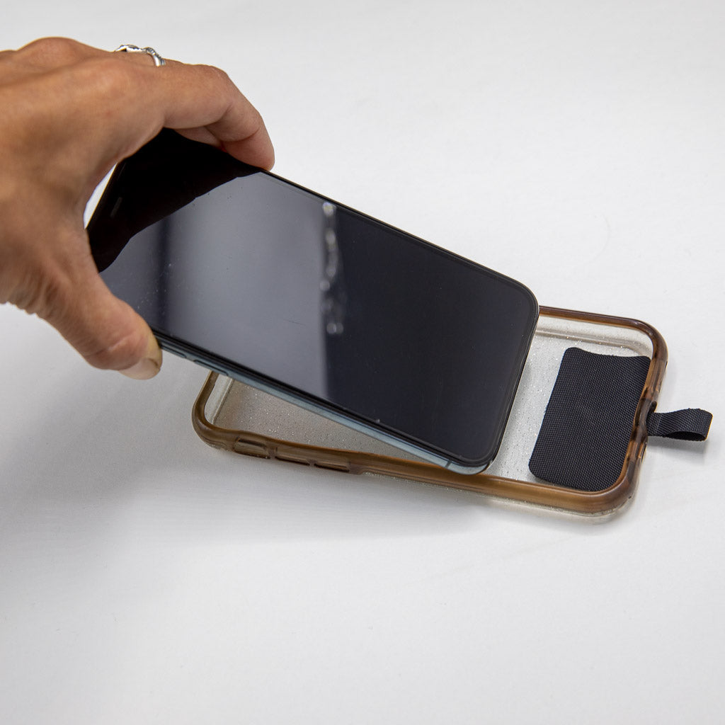 iOmounts® Magnetic Phone Tether Step two install is snap phone back in place in your case (Step Two: Snap phone back in place in your case.)