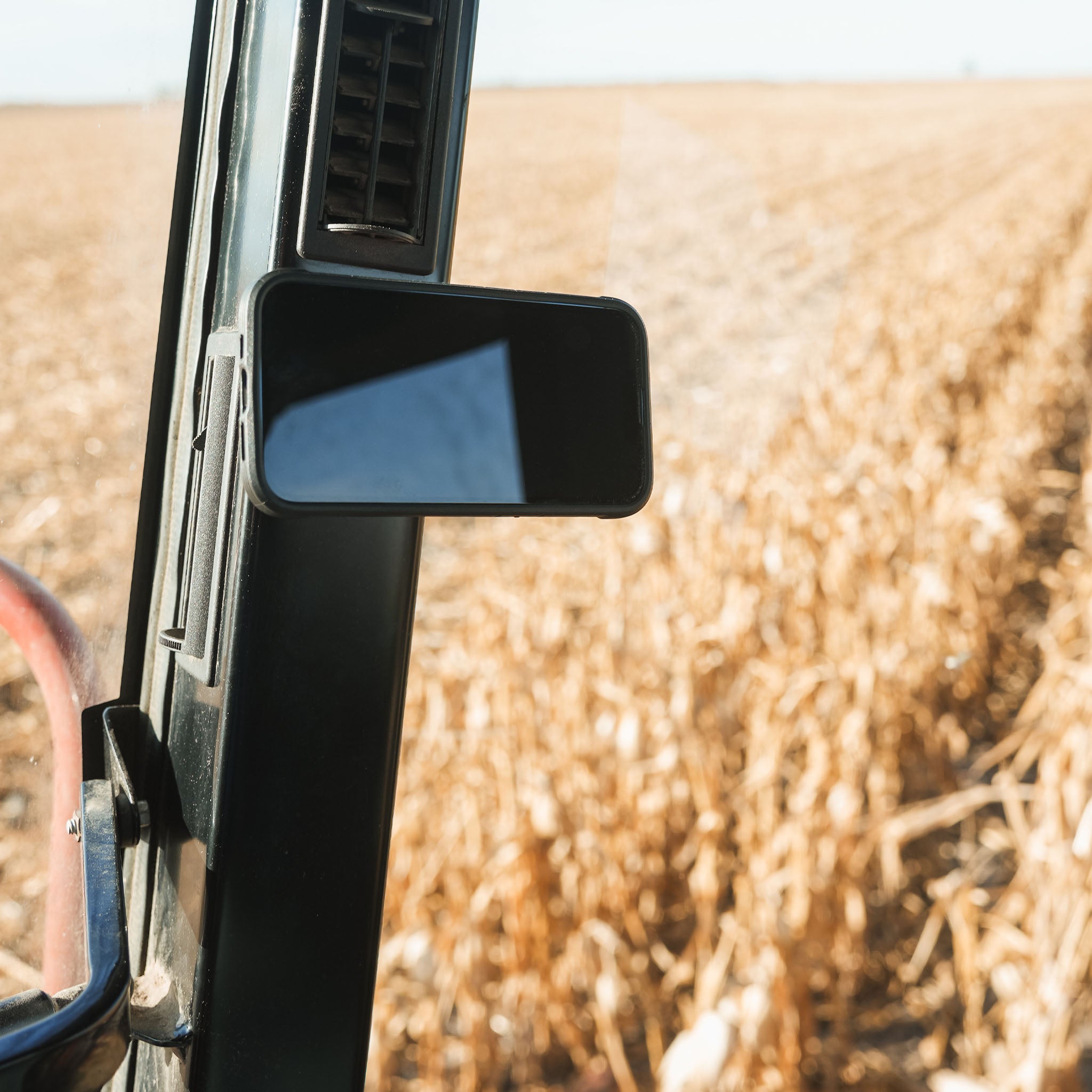 iOkwik Magnetic Universal Phone Mount shown mounted in combine(mounted in combine)
