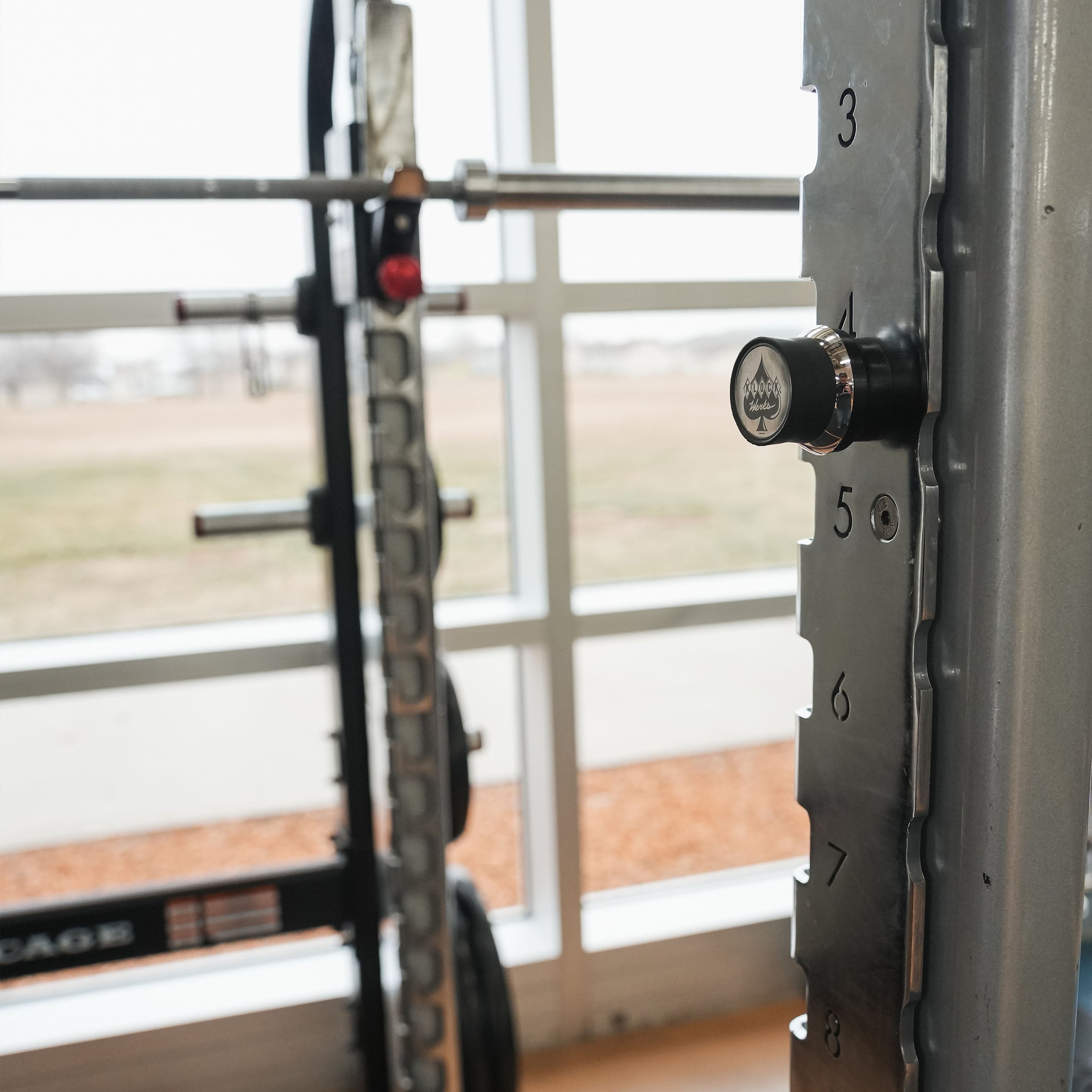 iOkwik Magnetic Universal Phone Mount mounted to rack in the gym(in the gym)