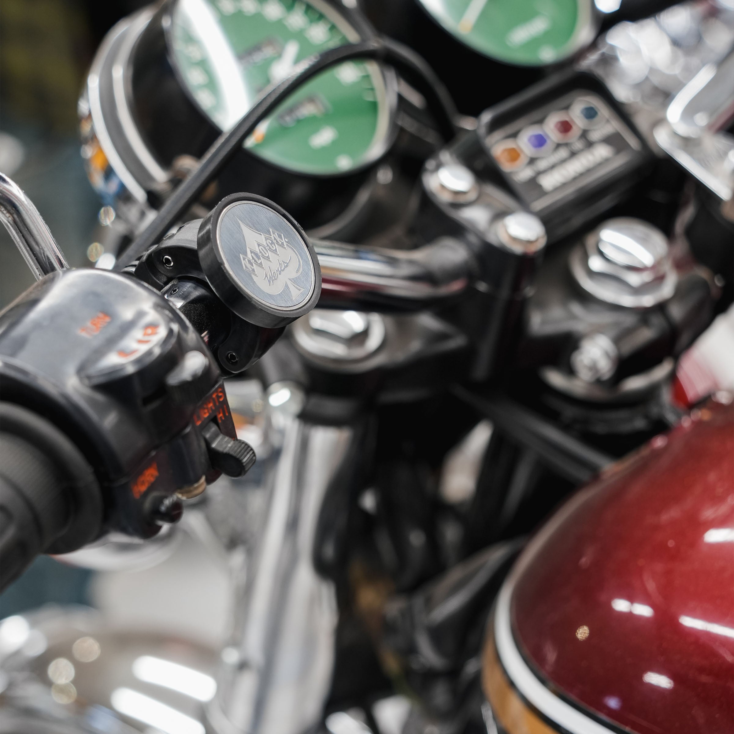 1.0" nomad+ Universal Bar Magnetic Phone Mount shown on motorcycle handlebars(1.0" on motorcycle bars)
