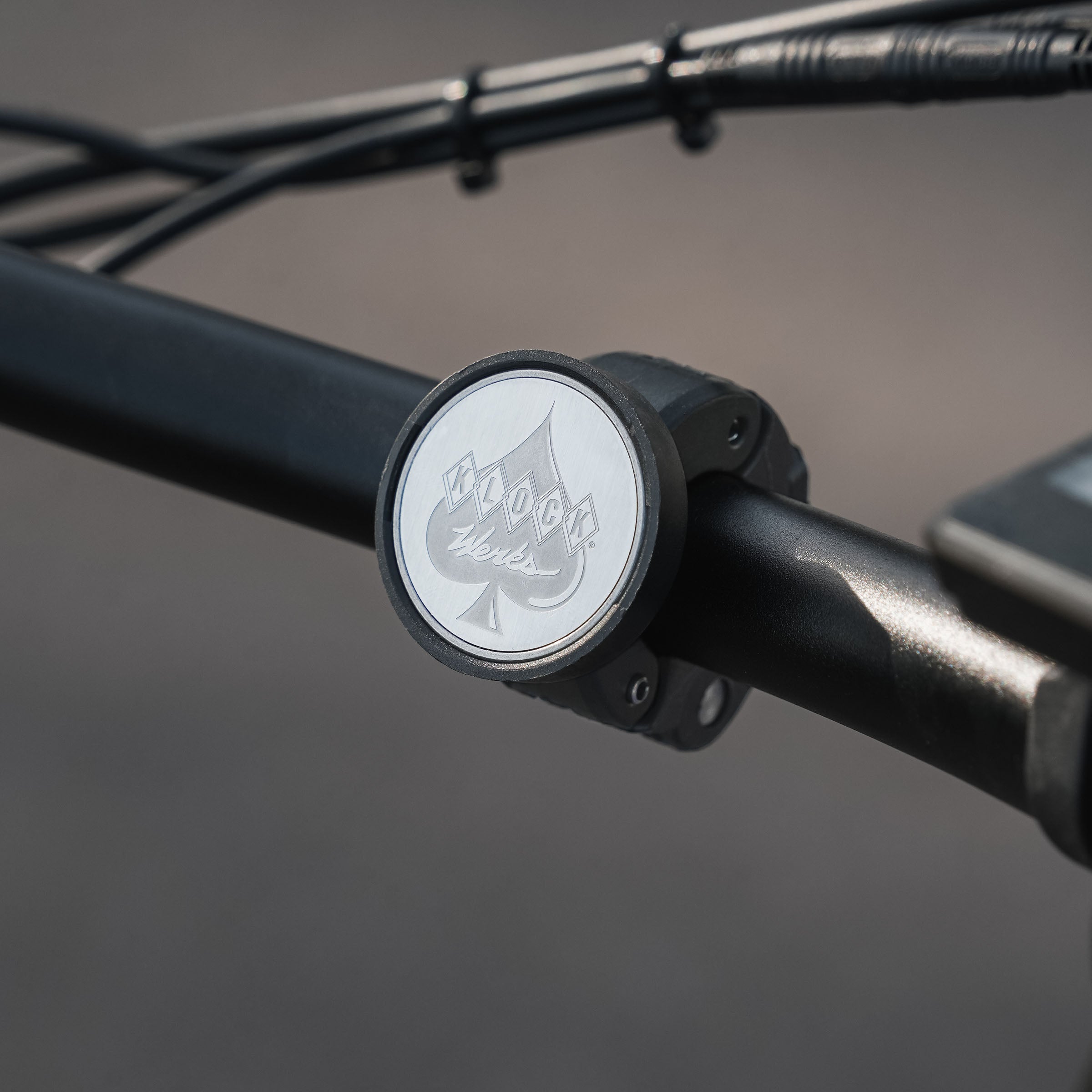 0.875" nomad+ Universal Bar Magnetic Phone Mount shown on black handlebar(0.875")