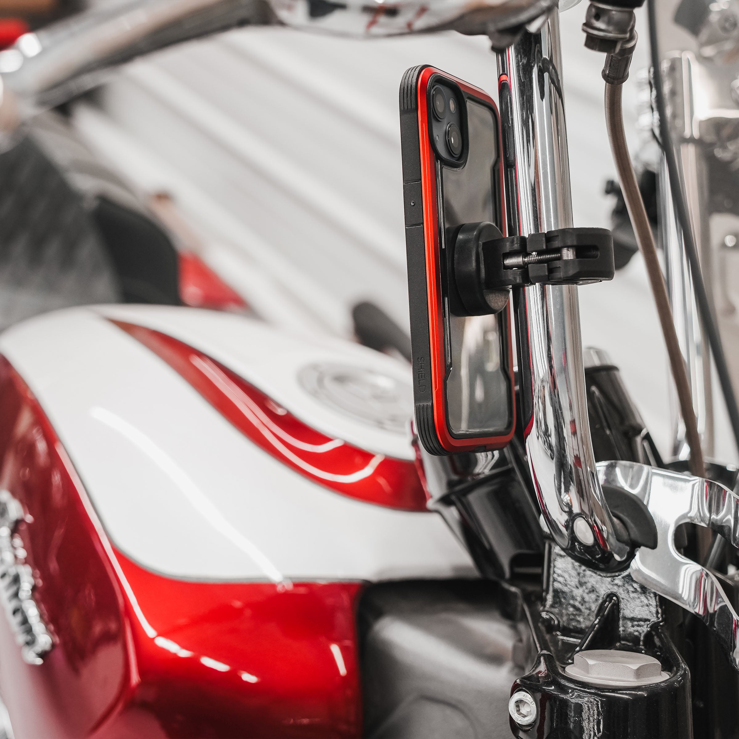 1.0" nomad+ Universal Bar Magnetic Phone Mount shown on motorcycle handlebars(1.0" on motorcycle bars)