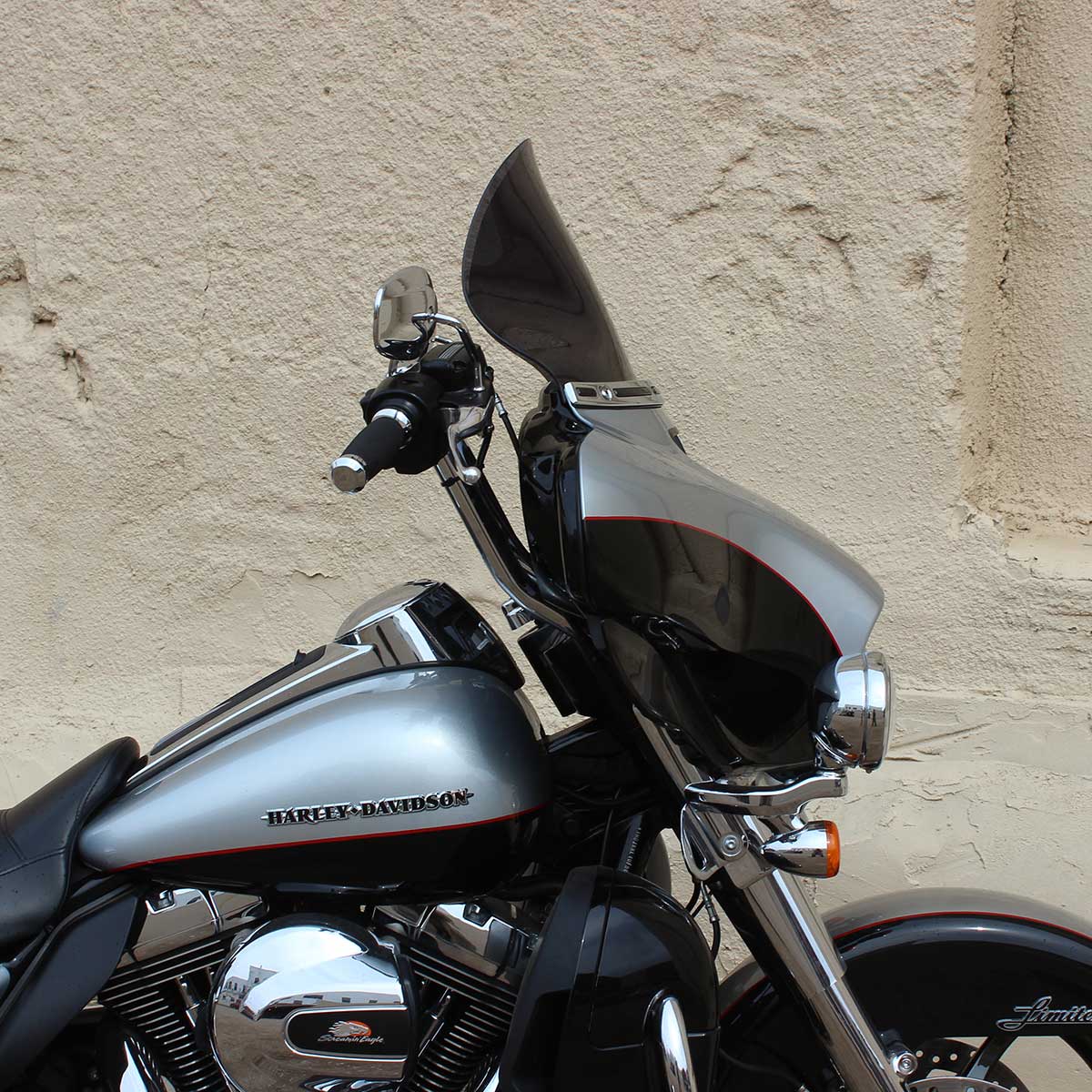 Harley-Davidson motorcycle featuring a Flare® windshield, showcasing sleek design and chrome accents, emphasizing aftermarket accessories for enhanced riding experience. 11.5" Dark Smoke Motorcycle Windshield for 2014-2023 Harley-Davidson FLH Motorcycle Models(11.5" Dark Smoke)
