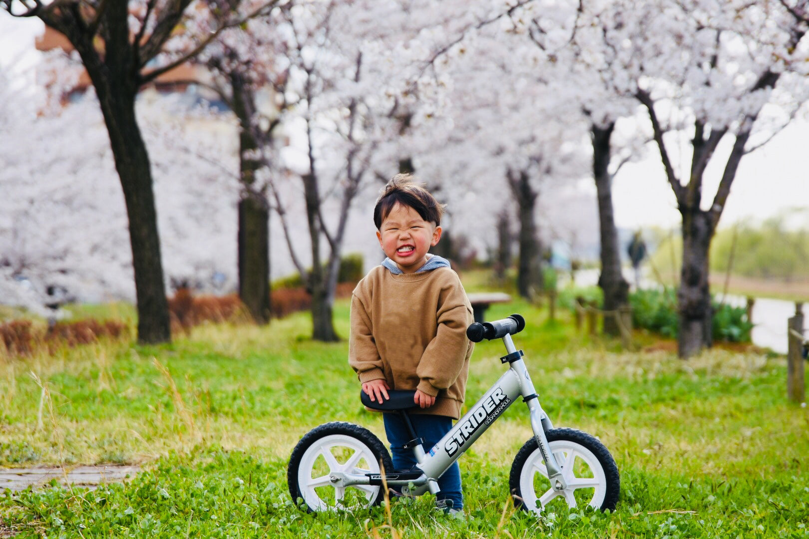 Silver 12" Pro Strider Balance Bike Silver in use (12" Pro - Silver in use)