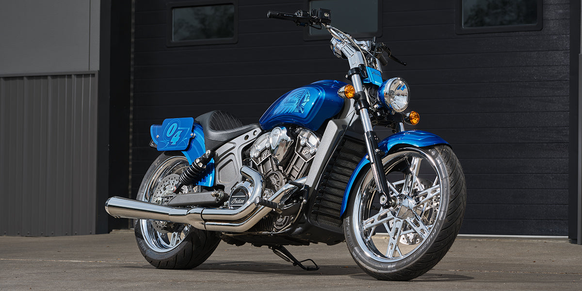 A custom 2015 Indian® Scout motorcycle, painted metalic blue with chrome accents and the number 04 displayed on the side.