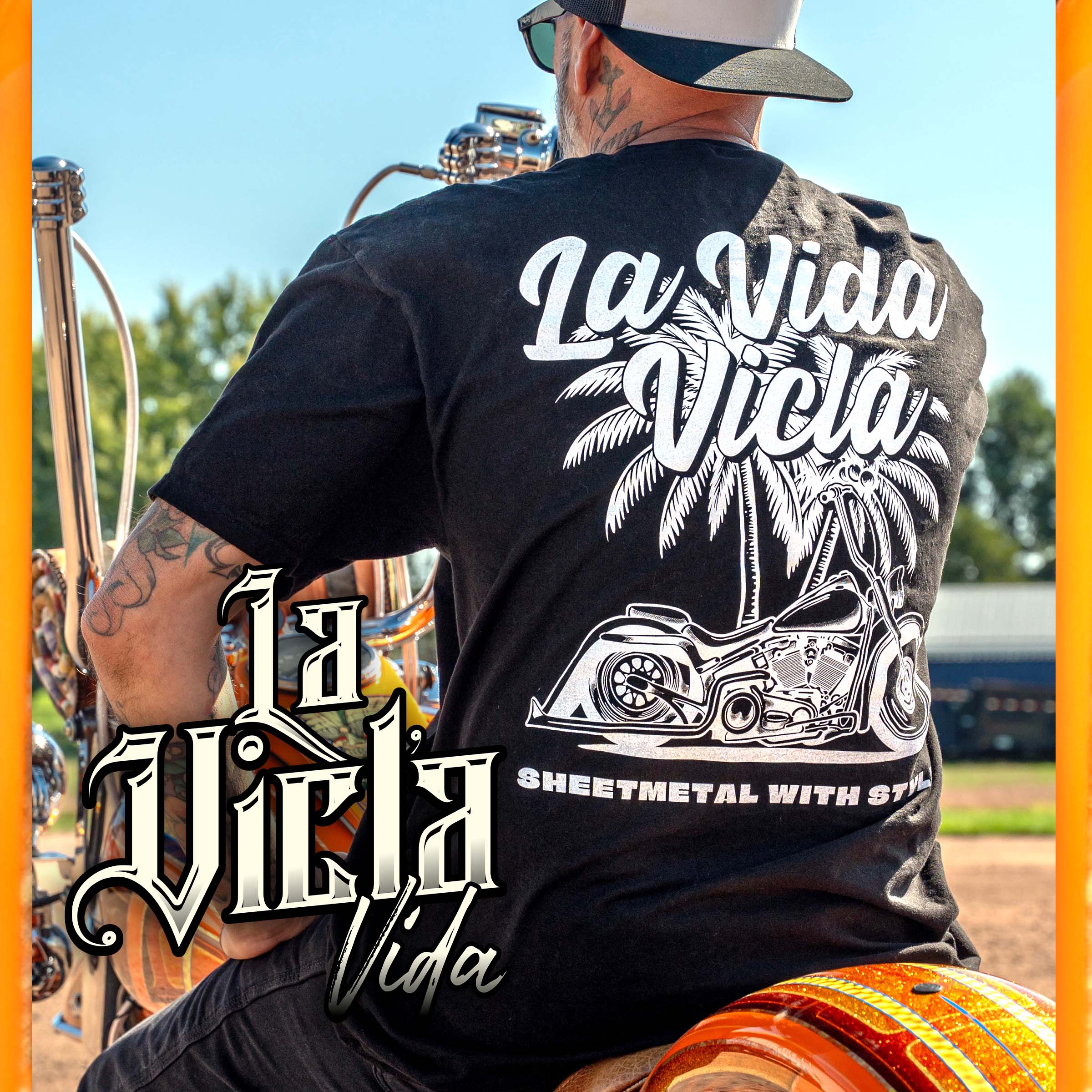 Black t-shirt with 'La Vida Vicla' graphic design featuring a motorcycle and palm tree on a white background.