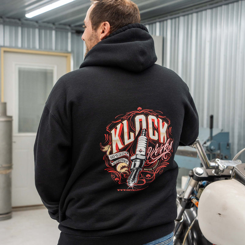 Back Design of Black Zip-Up Hoodie with Spark Plug Design on model wearing XL (Model is wearing XL)