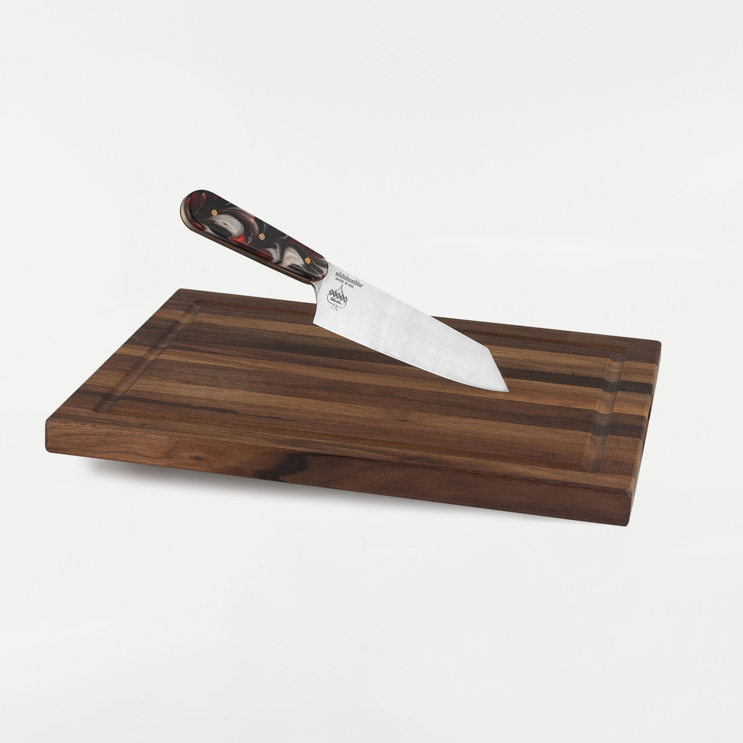 Klock Werks x White Knuckler Limited Edition Chef Set featuring 11-inch chef knife with a 7-inch 154CM high carbon stainless steel blade and an American walnut cutting board with recessed pocket and 44 lb magnet for secure storage.