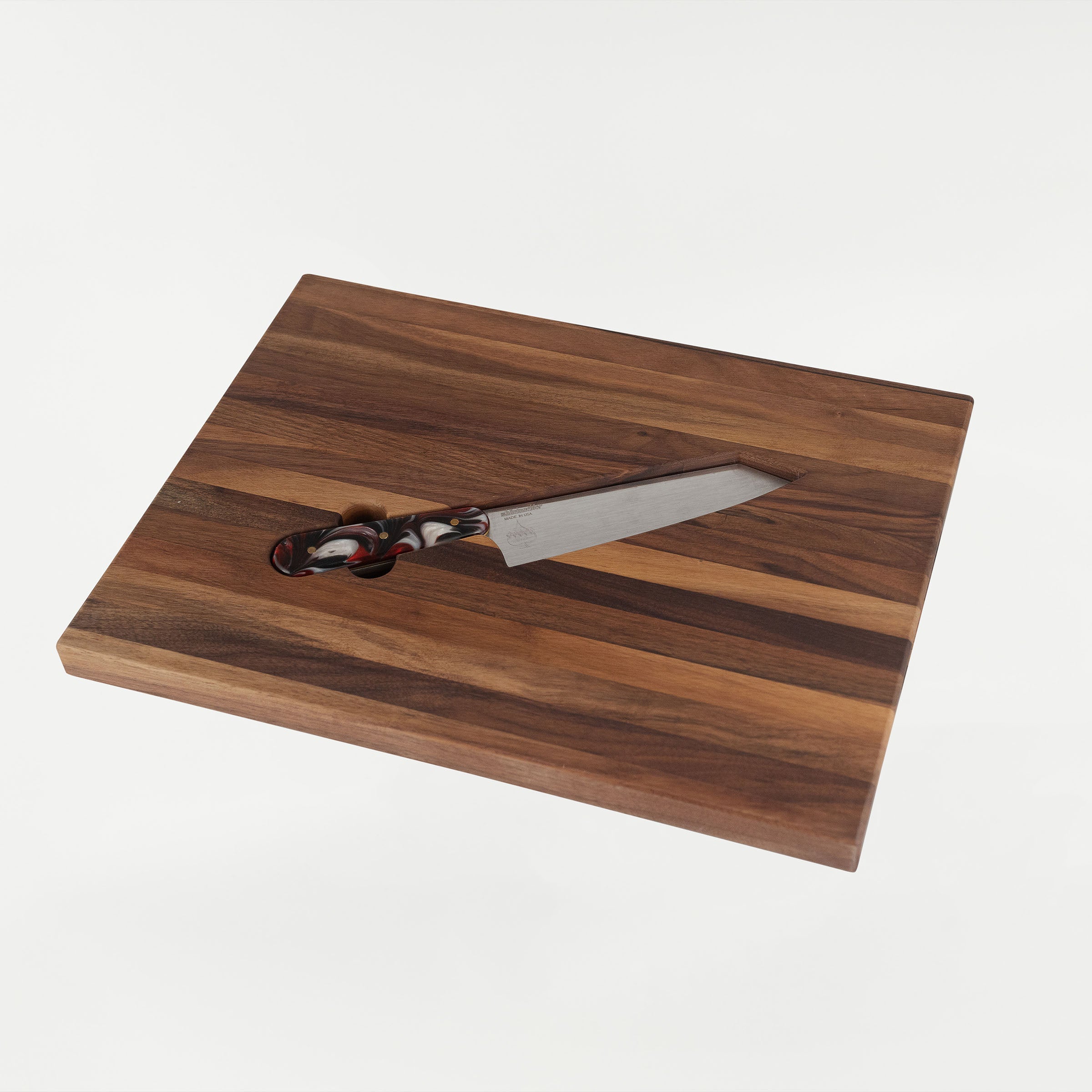 Klock Werks x White Knuckler Limited Edition Chef Set featuring 11-inch chef knife with a 7-inch 154CM high carbon stainless steel blade and an American walnut cutting board with recessed pocket and 44 lb magnet for secure storage.