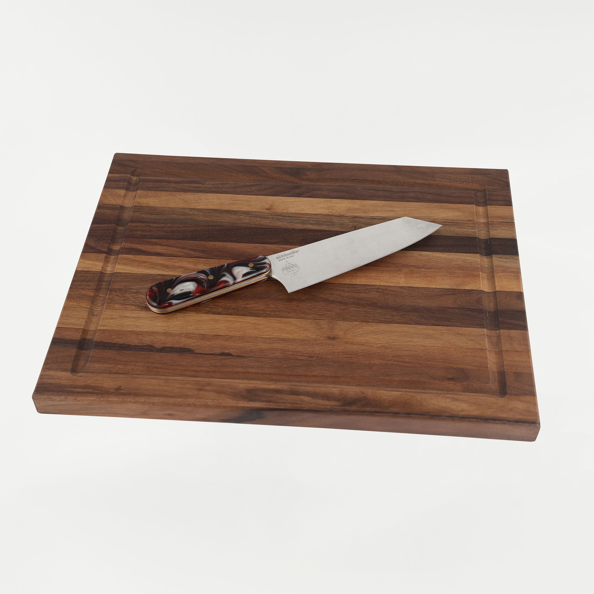 Klock Werks x White Knuckler Limited Edition Chef Set featuring 11-inch chef knife with a 7-inch 154CM high carbon stainless steel blade and an American walnut cutting board with recessed pocket and 44 lb magnet for secure storage.