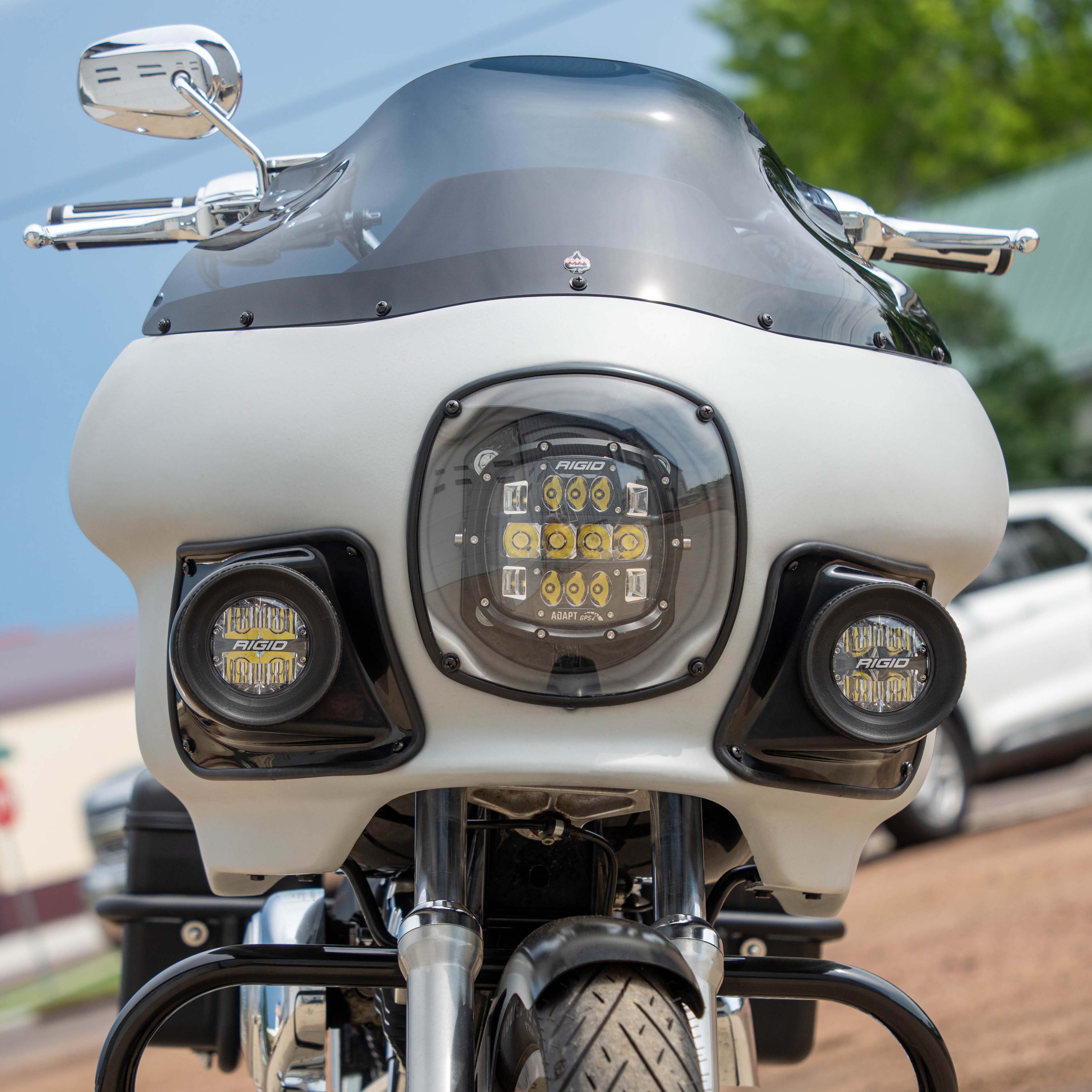 Klock Werks FXRP Light Pods on an FXRP Fairing outside in a gravel parking lot on a sunny day with chrome accents and Rigio lighting 