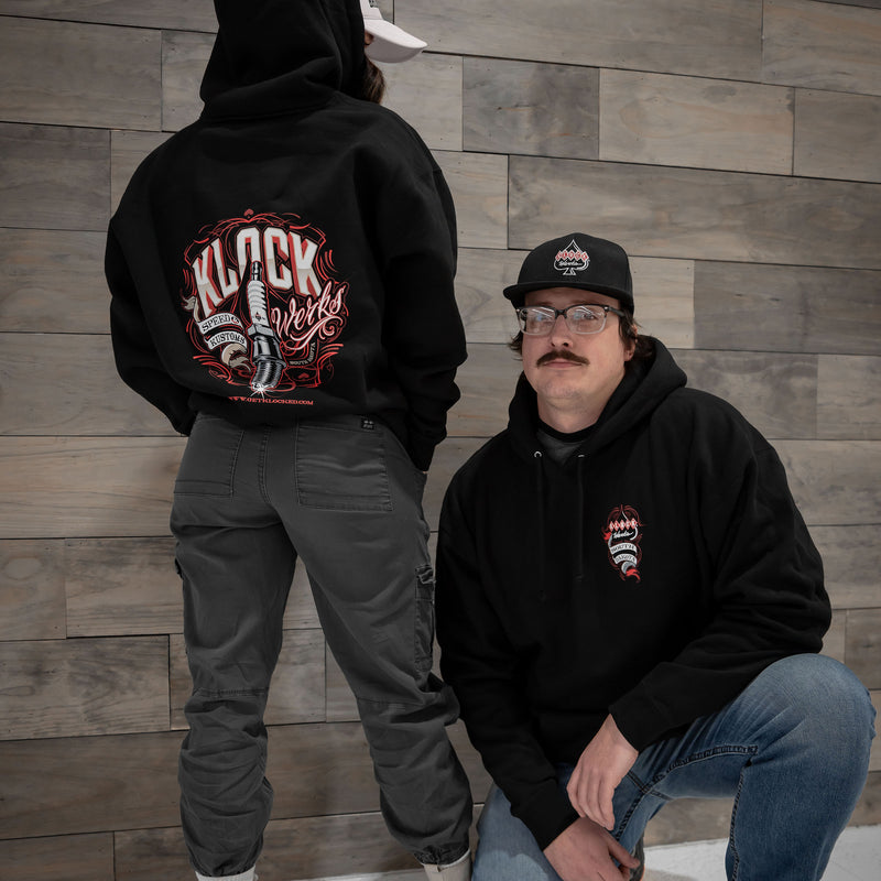 Black Pullover Hoodie with Spark Plug Design on Front Chest (Pullover Models are wearing M and 2XL)