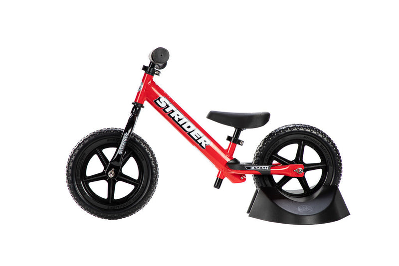 Strider Plastic Bike Stand holding a Strider Bike (Plastic Bike Stand holding a Strider Bike)