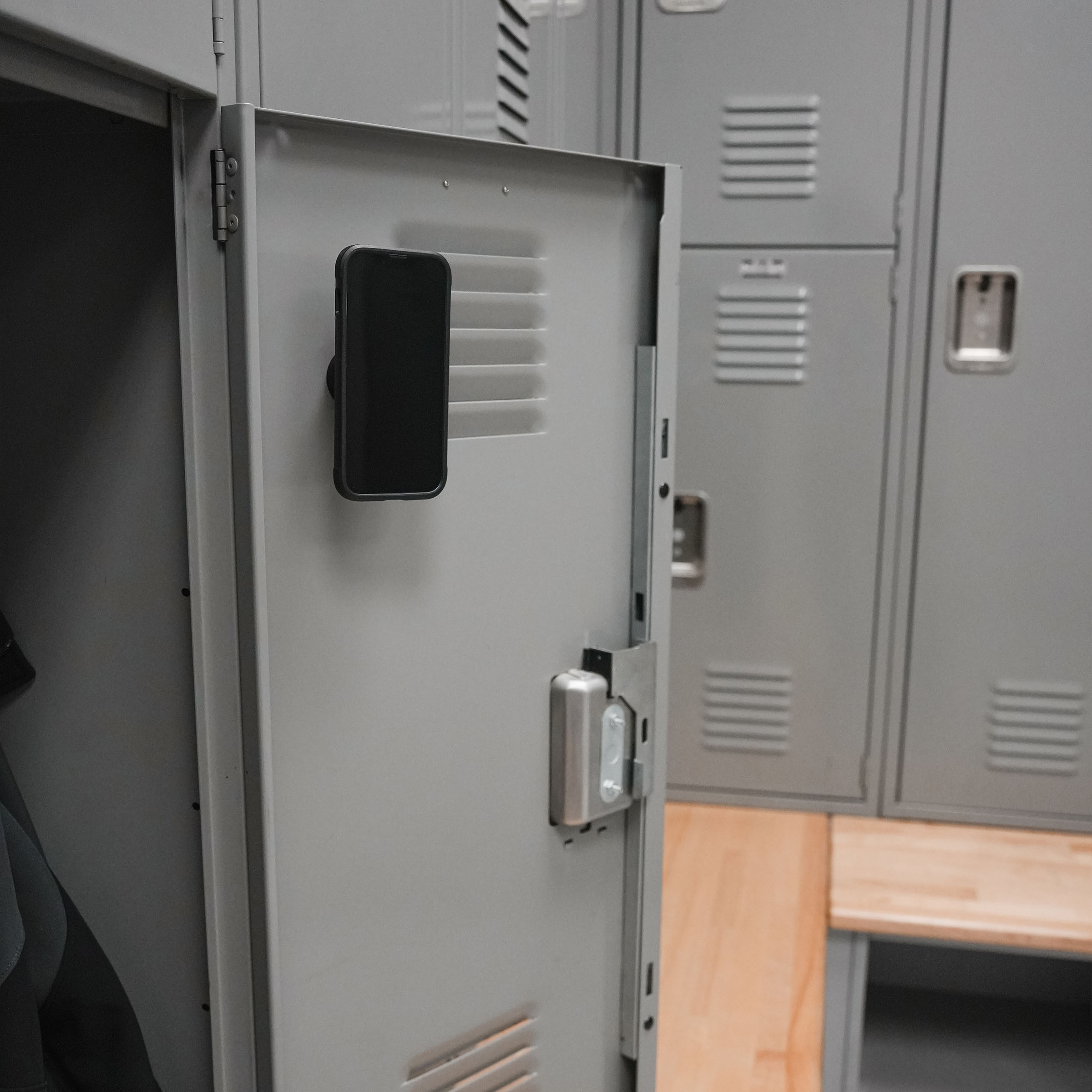 iOkwik Magnetic Universal Phone Mount shown mounted to locker(mounted to locker)