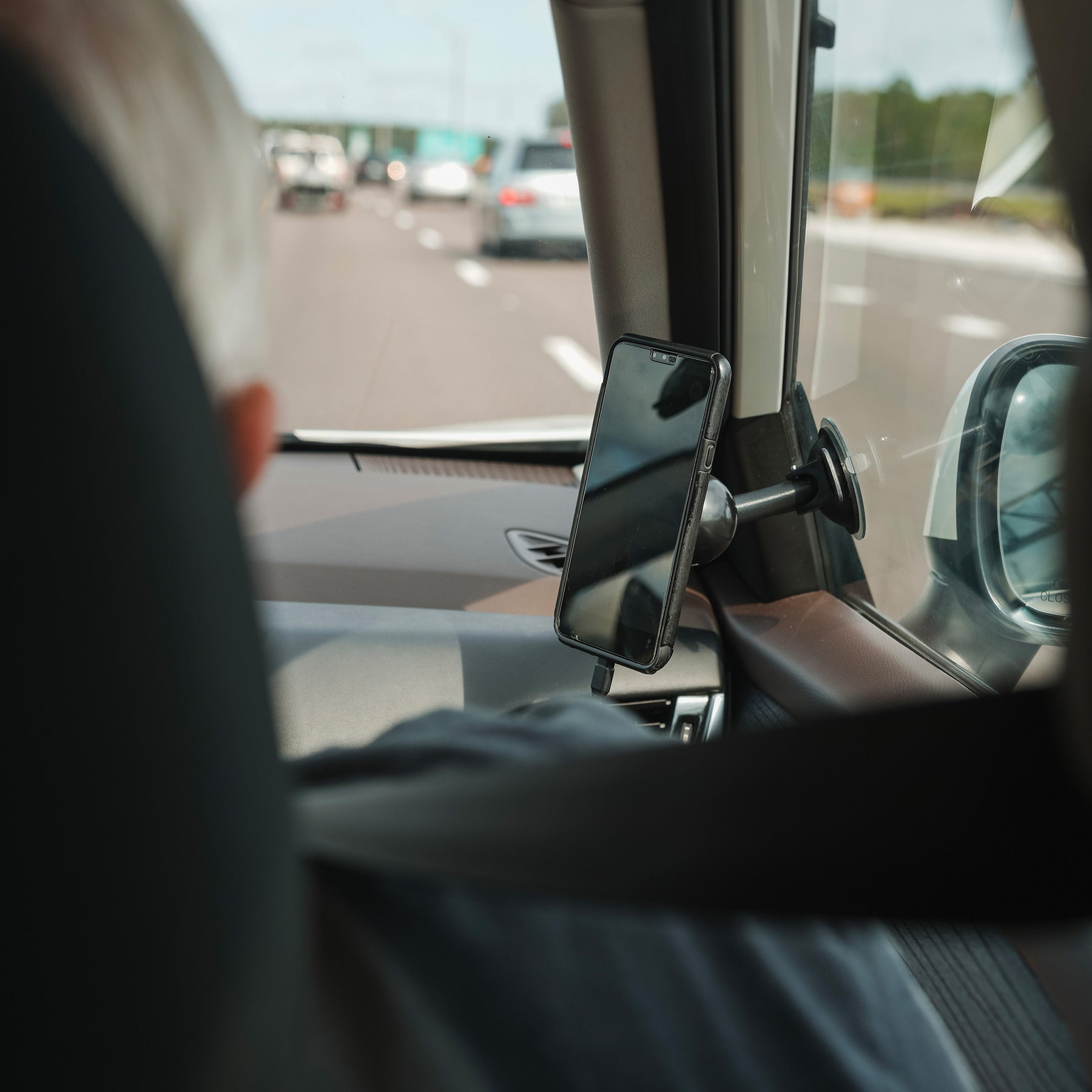 iOtraveler Suction Magnetic Phone Mount mounted to the passenger side window