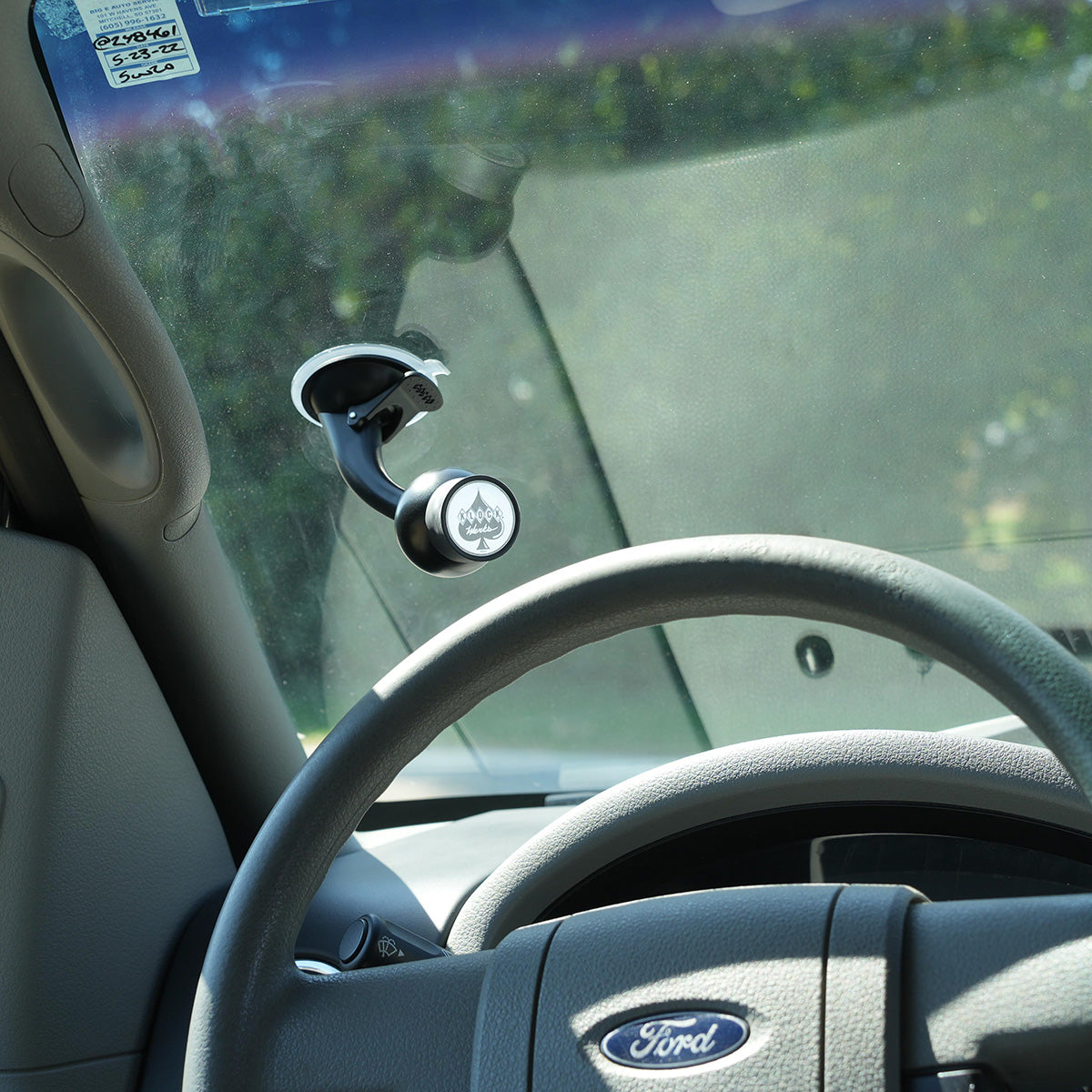 iOtraveler Suction Magnetic Phone Mount shown mounted to pickup windshield(mounted to pickup windshield)
