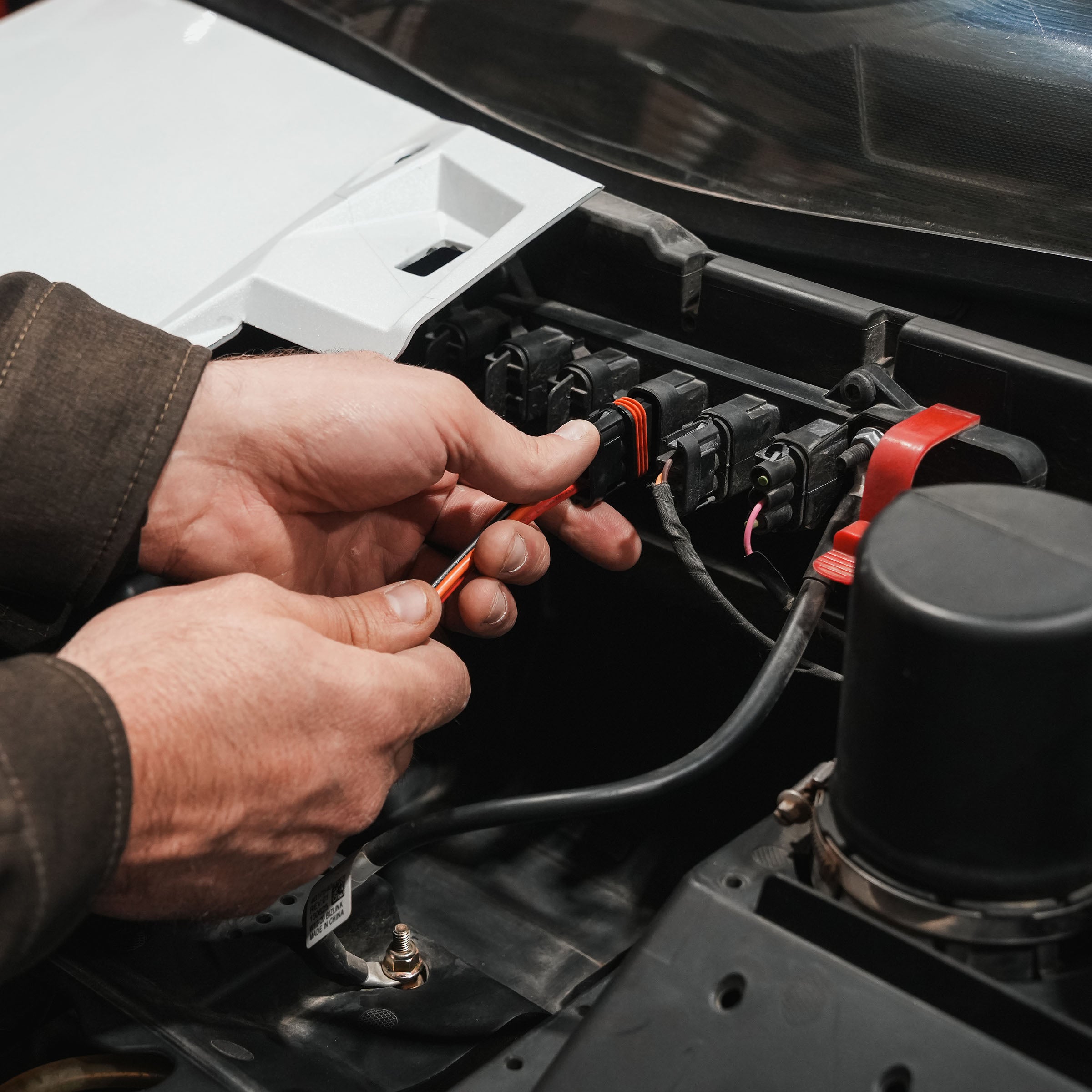 Polaris Pulse Busbar Pigtail Harness shown being installed(Polaris Pulse Busbar Pigtail Harness being installed)